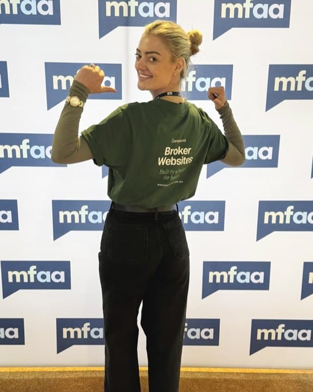 Rebecca Tickner at the MFAA National Conference wearing the WeCompound Broker Websites shirt